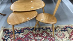 1960s Ercol teak and beech 'Pebble' nest of three tables, with makers trademark. 25ins. x 17ins.