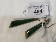 Jewellery: Yellow metal, pair of jade drop earrings. Tests as 14ct gold. Weight 7g.