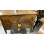 20th cent. German birds eye maple chest of two drawers, on tapering supports.