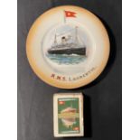 WHITE STAR LINE: R.M.S. Laurentic souvenir plate, plus a pack of White Star Line playing cards. (2)