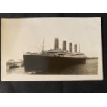 R.M.S. TITANIC: Unusual pre-disaster nautical photo agency real photo postcard of Titanic leaving