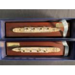 R.M.S. TITANIC: Boxed pair of modern Mercator cast models, on treen stands. 11½ins.