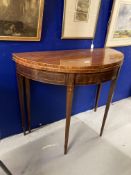 19th cent. Mahogany demi lune fold over tea table. Boxwood stringing on delicate tapering