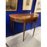 19th cent. Mahogany demi lune fold over tea table. Boxwood stringing on delicate tapering