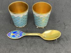 Danish gilt and enamel Christmas spoon, A Michelsen 1984, and two gilt and enamel Vodka tots.