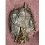 Tribal Art: 20th cent. Sub Saharan African leather bag decorated with shells, possibly Toureg with