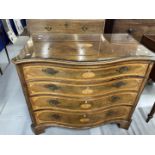 Early 19th cent. Mahogany inlaid with fruitwood, serpentine chest of drawers, oval mons inlays on
