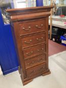 20th cent. Hardwood chest of five drawers plus one concealed glove drawer. 26ins. x 18ins. x 51½