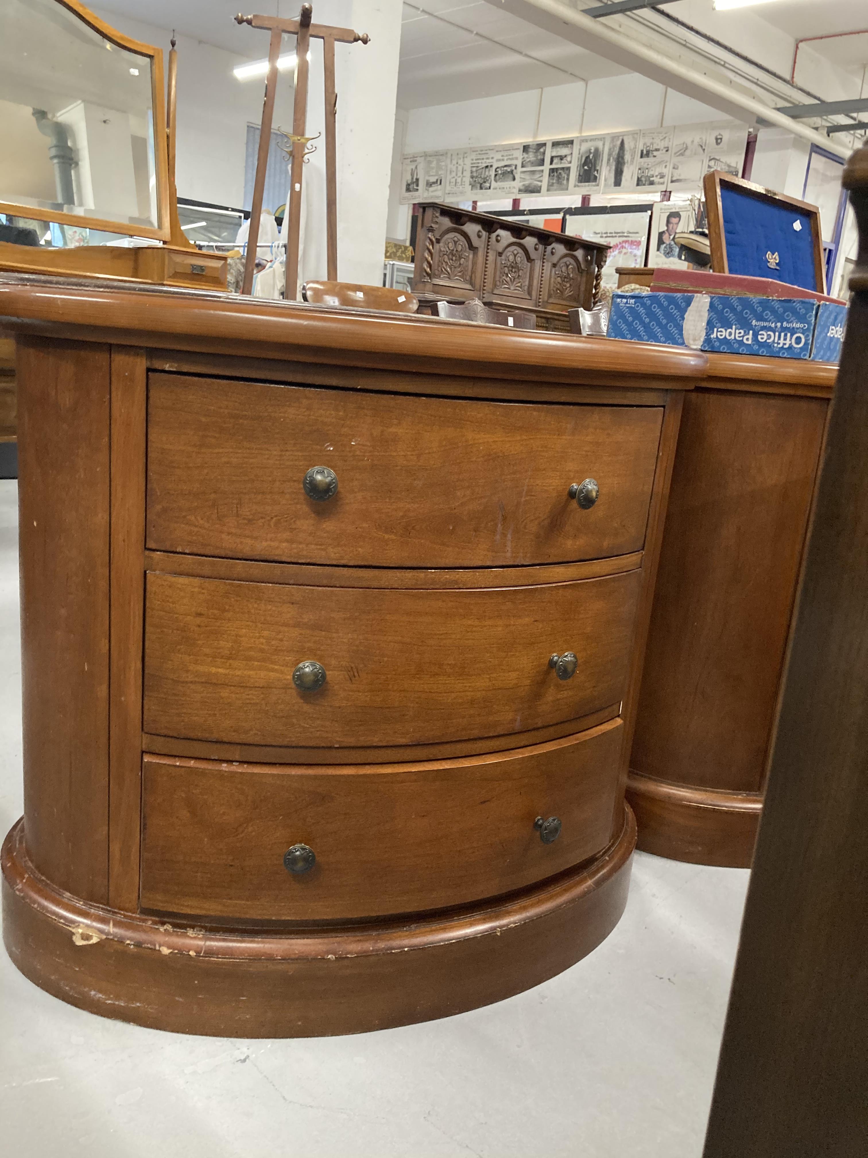 Modern leather topped oval chest of drawers, a pair. 33ins.
