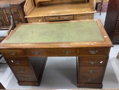 Edwardian oak double pedestal desk with green leather skiver. 48ins. x 30ins. x 24ins.