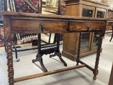 20th cent. Oak dwarf two drawer buffet on barley twist support. 42ins. x 17ins. x 30ins.