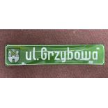 Poland enamel town sign, green with white lettering and coat of arms.
