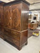 19th cent. Flame mahogany linen press two opening inlaid doors revealing five slides, two over three