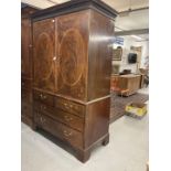 19th cent. Flame mahogany linen press two opening inlaid doors revealing five slides, two over three