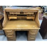 20th cent. Oak double pedestal tambour front desk with fully fitted interior. 50ins. x 49½ins. x