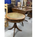 20th cent. Mahogany oval drop leaf table, two drawers beneath and quad supports with brass