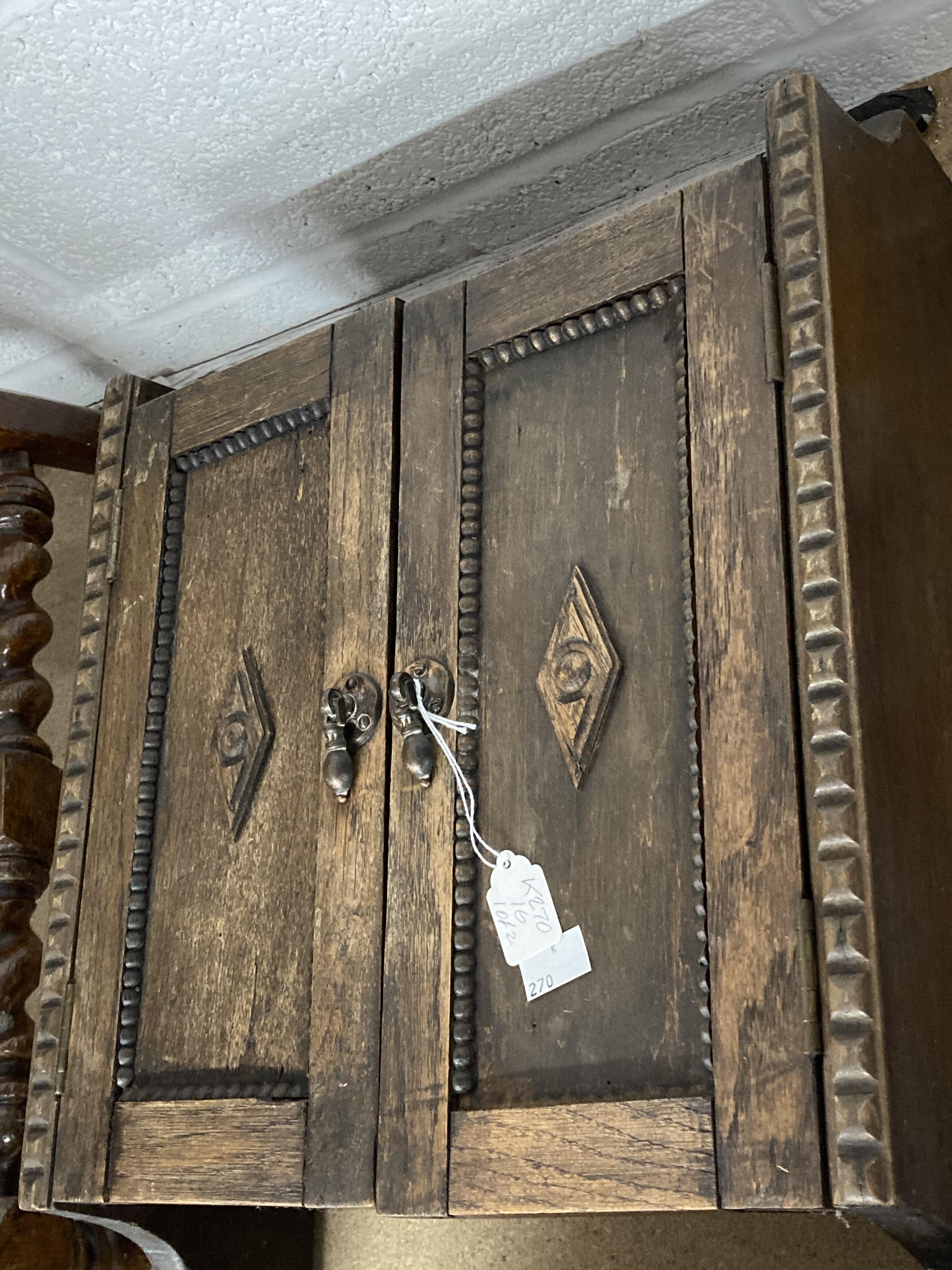 20th cent. Oak wall mounted cupboard, with applied beaded and diamond shaped mouldings. 20ins. x