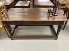 18th cent. Oak refectory table with heavily carved tapering supports and inlaid footrest/stretchers.