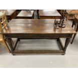 18th cent. Oak refectory table with heavily carved tapering supports and inlaid footrest/stretchers.