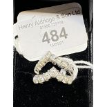 Hallmarked Gold: 18ct white gold pair of diamond set wishbone rings, each set with seven brilliant