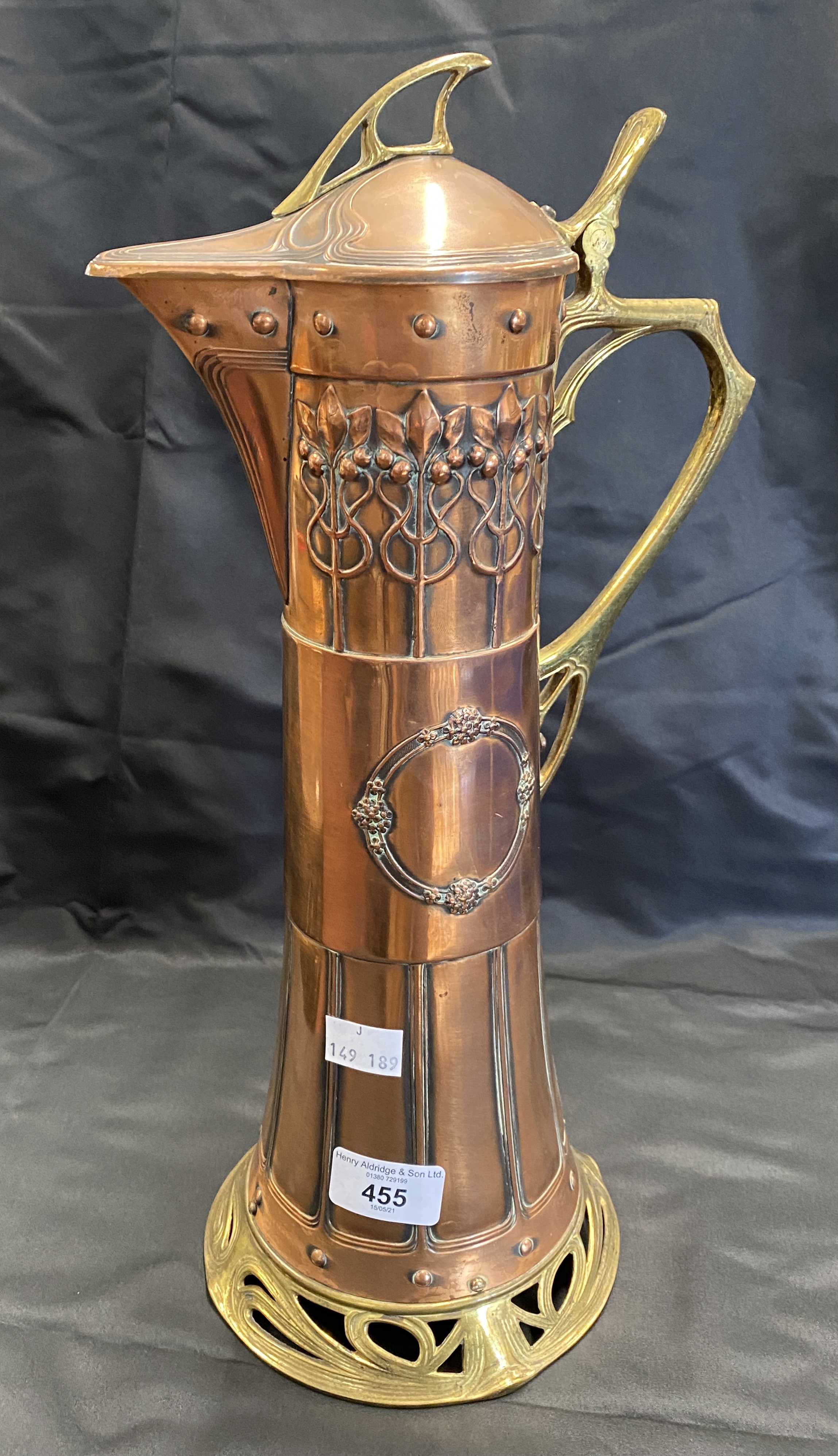 Art Nouveau: WMF copper and brass claret jug with stylised decoration.