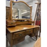 20th cent. Mahogany dressing table on tapering supports. 53ins. x 67ins. x 20ins.