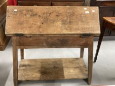 Late 19th cent. Pitch pine tack room table, the folding triangular top opening to form a work
