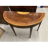 20th cent. Mahogany demi-lune pier table, fruitwood inlaid with a geometric motif, on tapering spade