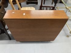 1970s teak drop leaf table, retailed by McIntosh. 59ins. x 36ins extended. 8½ins. x 36ins stowed.