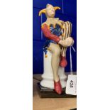 20th cent. Continental Ceramics: Unmarked Jester figurine, copy of a Royal Doulton figure. 10ins.