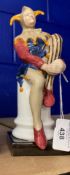 20th cent. Continental Ceramics: Unmarked Jester figurine, copy of a Royal Doulton figure. 10ins.