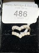 Jewellery: Two individual diamond seven stone wishbone rings. Each ring set with seven round