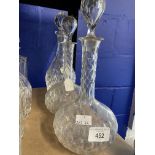 19th/20th cent. Glassware: Pair of wheel cut onion base decanters with elongated necks 10½ins