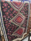 Rugs: 20th cent. Eastern black ground runner with geometric decoration. Approx. 38ins. x 78ins.