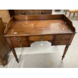 Late 19th/early 20th cent. Mahogany galleried ladies desk with five drawers, on turned supports.