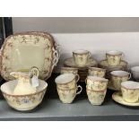 20th cent. Ceramics: Royal Worcester twelve place setting tea set, cream ground, pink border with