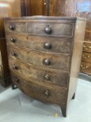 19th cent. Mahogany bow front chest of two short drawers and three long drawers on swept bracket