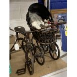 Toys: Dolls toys reproduction of a 19th cent. Metal and basket ware dolls pram and a reproduction of