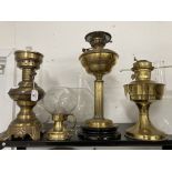 Lighting: Early 20th cent. Three brass paraffin lamps Aladdin Daniel, Griffin Brand and an unnamed