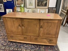 20th cent. Ercol style Windsor oak sideboard. Three cupboards over two drawers with two cutlery