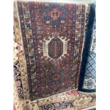 Carpets & Rugs: 20th cent. Bokhara runner, red ground, five guls with geometric pattern, three