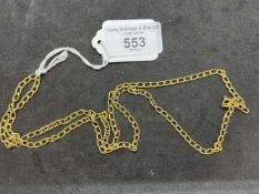 Jewellery: Yellow metal curb link chain stamped 750, tests as 18ct gold. Length 27½ins. Width 3.5mm.