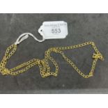 Jewellery: Yellow metal curb link chain stamped 750, tests as 18ct gold. Length 27½ins. Width 3.5mm.