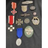 Militaria: Third Reich, a quantity of replica medals and badges to include Iron Cross 1st Class,