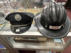 United States Fire Helmet Marked WYSOY Vol Fire Co. Plus a Brook Park Fire Dept. peaked cap. (2)