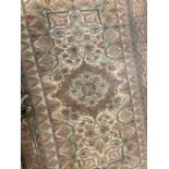 Carpets & Textiles: 20th cent. Beige ground with large central floral gul. Five borders all with