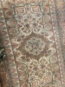 Carpets & Textiles: 20th cent. Beige ground with large central floral gul. Five borders all with