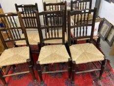 20th cent. Oak spindle back rush woven seated dining chairs x 6.