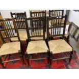 20th cent. Oak spindle back rush woven seated dining chairs x 6.