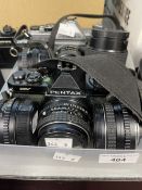 Cameras: Two Pentax analogue SLR cameras with six lenses. Asahi K1000 camera fitted with an Asahi